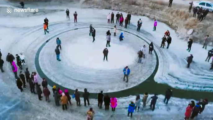 Spinning ice circle in northeast China attracts visitors