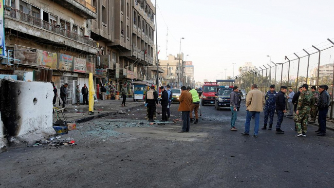 Iraq: dozens killed as suicide bombers hit Baghdad market