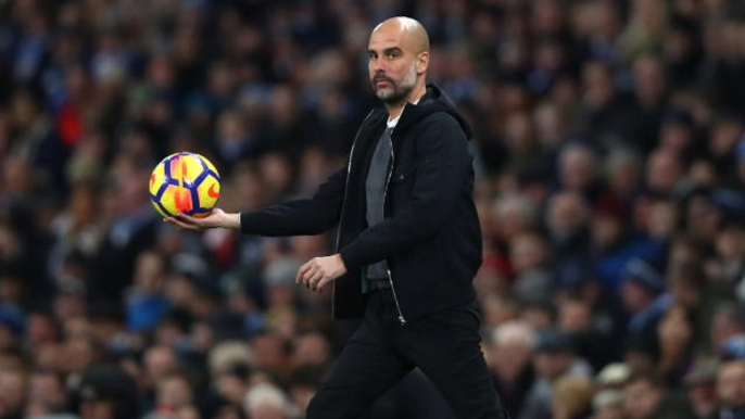 Man City's Guardiola still loving life in England