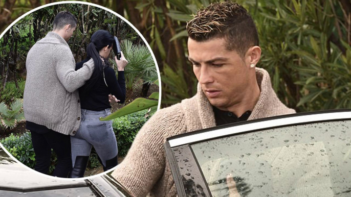 Sombre Cristiano Ronaldo puts his arm around girlfriend Georgina Rodriguez in Marbella... as they put on a united front amid claims 'he sent model Rhian Sugden a slew of texts'.