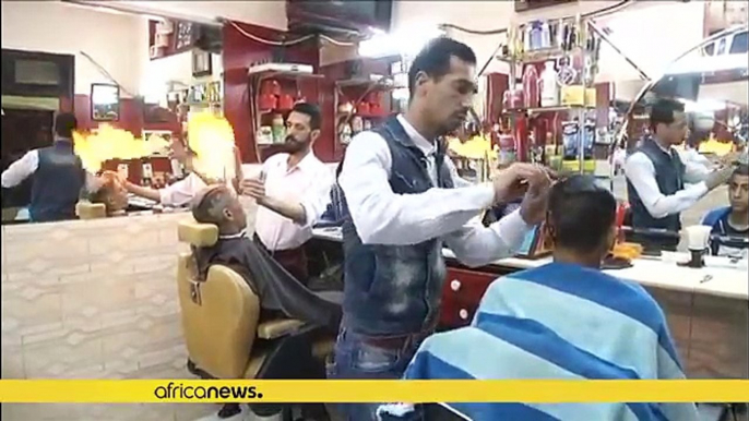 Meet the Egyptian barber using fire to straighten and style hair