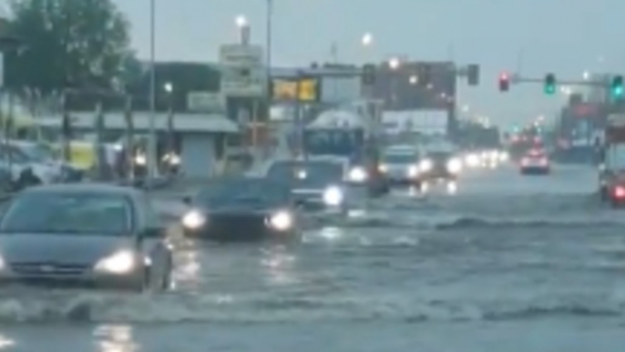 Cars Drive Through Flooded Road as Storm Hits Oklahoma