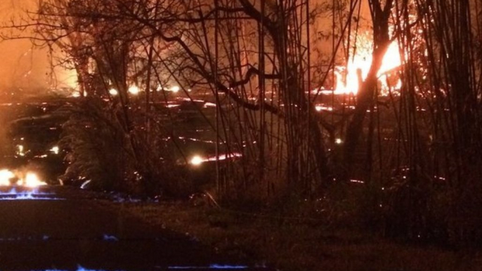 Blue Flames Emerge Between Road Cracks During Kilauea Volcano Eruption