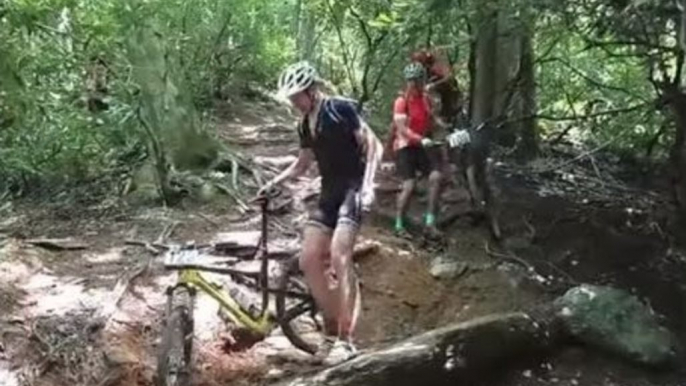 Spectator Jokingly Heckles Contestants in Mountain Bike Race