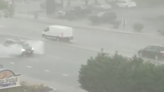 Cars Drive Through Flooded Streets in Ocean City, Maryland