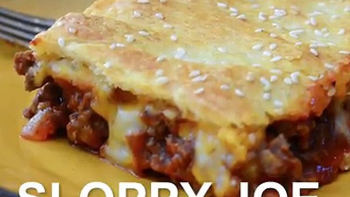 These SLOPPY JOE SQUARES have all the goodness of Sloppy Joes in casserole form! A made from scratch  filling is topped with cheese and baked between layers of