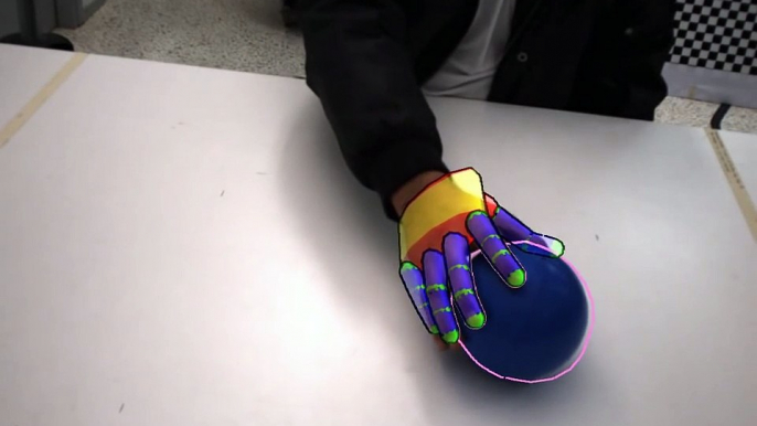 Tracking of a hand interacting with an object by modeling occlusions and physical constraints