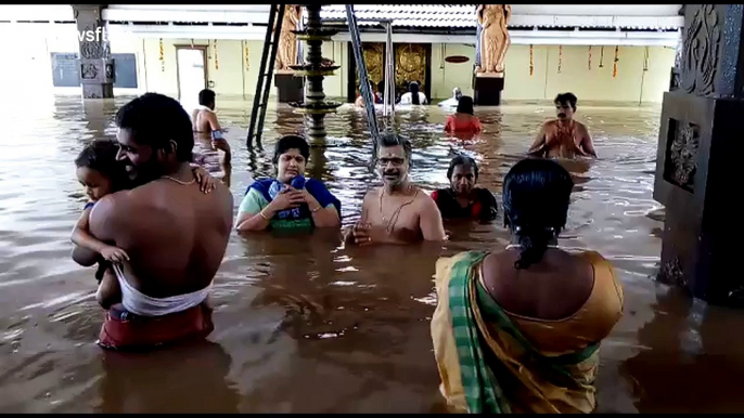 Devotees pray at submerged temple during Kerala floods