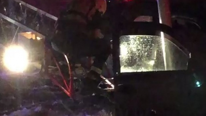 Tucson Firefighters Use Ladder to Rescue Pair Trapped in SUV