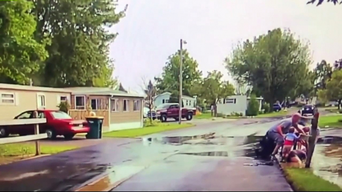 Caught on Dashcam: Officer Helps Rescue 9-Year-old Boy from Flooded Culvert