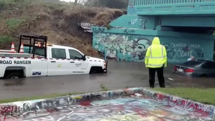 Car Gets Stuck in Floodwaters Under Pensacola's 'Graffiti Bridge'