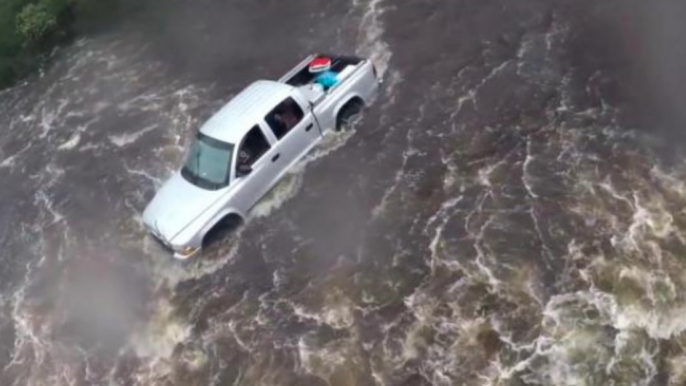 Coast Guard Swimmer Investigates Truck in North Carolina Flooding