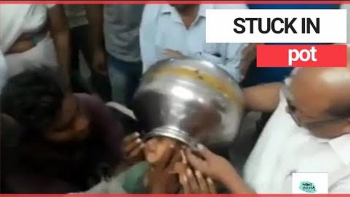 Boy gets head stuck in metal pot | SWNS TV