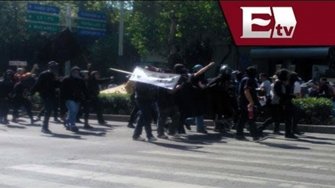 Marchan encapuchados para exigir la liberación de uno de sus compañeros / Vianey Esquinca
