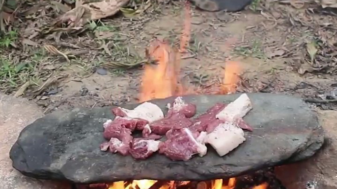 Cooking meat on a flat stone. via Primitive Technology Idea, bit.ly/2C8JOHh