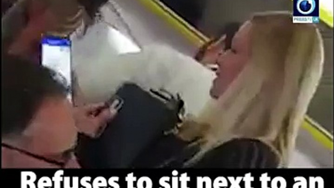 Racist man on Ryanair flight refuses to sit next to elderly woman because she's black!