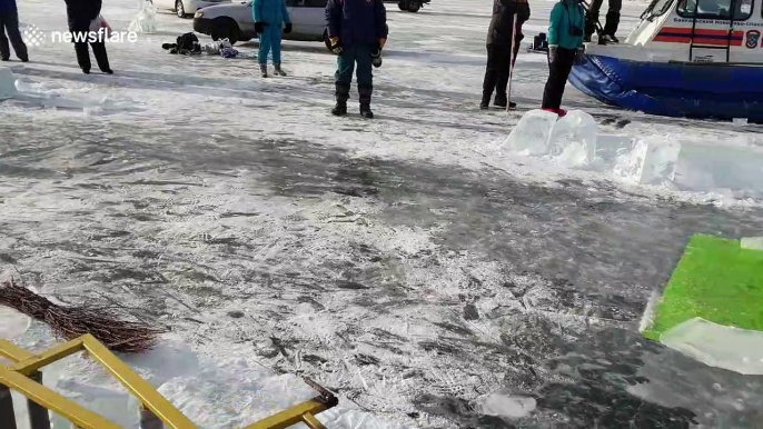 Russian man swims 25m under ice at world's deepest lake