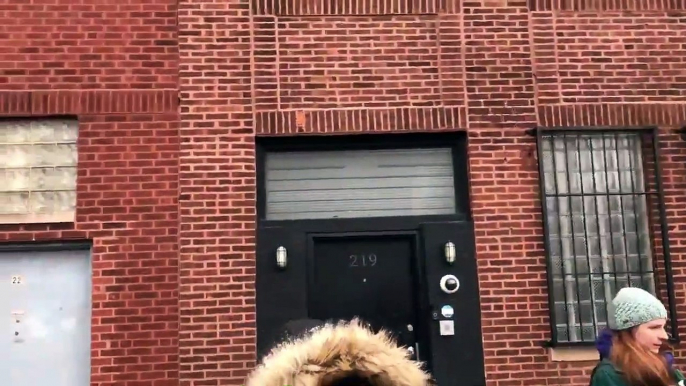 R. Kelly protesters and supporters clash, in front of his Chicago studio, as they scream at each other with megaphones, standing right in front of each other