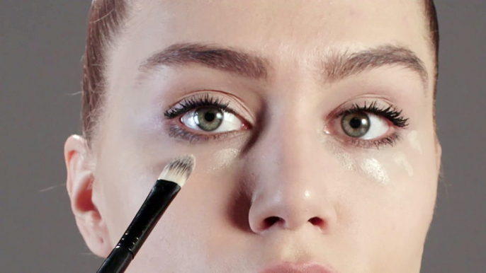 applying concealer