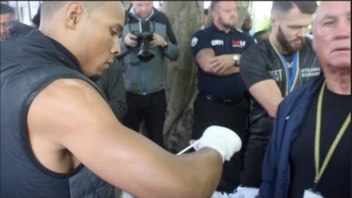 CHRIS EUBANK JR WRAPS HIS HANDS W/ RONNIE DAVIS UNDER MONOCLED EYE OF CHRIS EUBANK SR *ENGLISH*