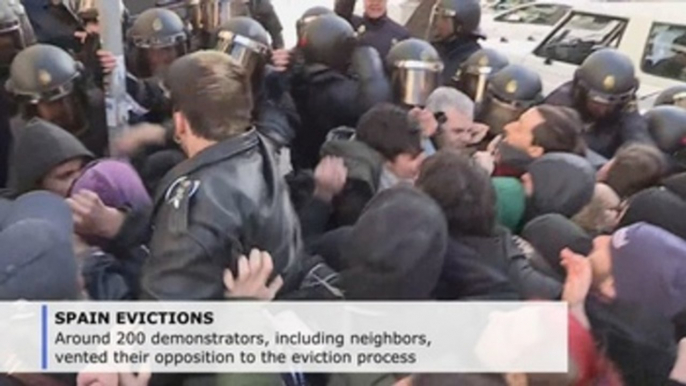 6 arrests, scuffles as police evict four families in the Spanish capital