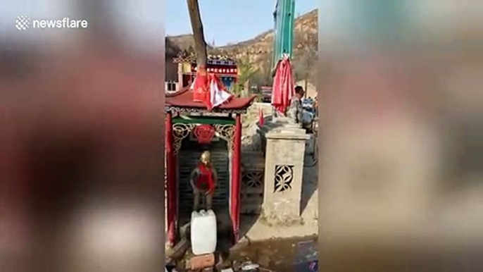 Chinese villagers build ‘peeing boy’ statue to divert spring water from mountain