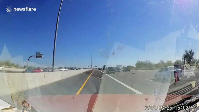 ‘This freaking sucks!’ US driver reacts to near miss with overtaking car on freeway