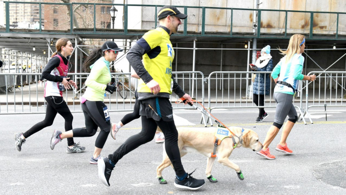 Visually Impaired Man Runs Half Marathon Completely Guided by Dogs