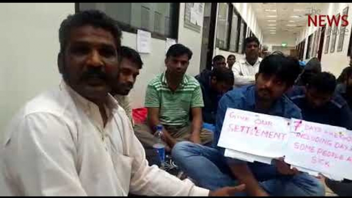 Unpaid for months, Indian workers sit in protest outside Kharafi National office