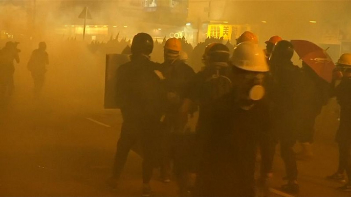 Police fire tear gas during anti-government protests in Hong Kong