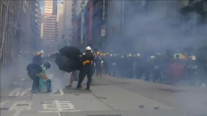 Police in Hong Kong fire tear gas as street protests continue