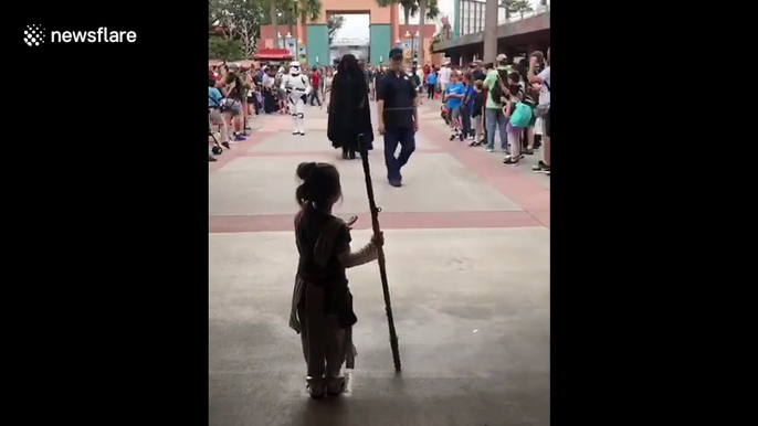 Four-year-old girl dressed as Rey meets Star Wars characters at Disney World in Florida