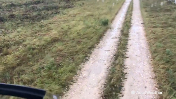 Helicopter makes emergency landing on flooded road