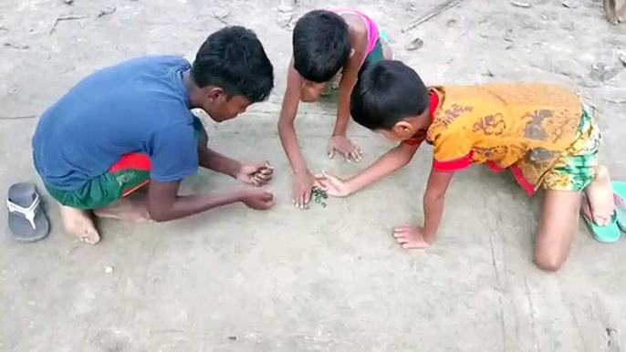 Children playing Marbles. Such a great game and a shame it isn't played alot in USA and UK!