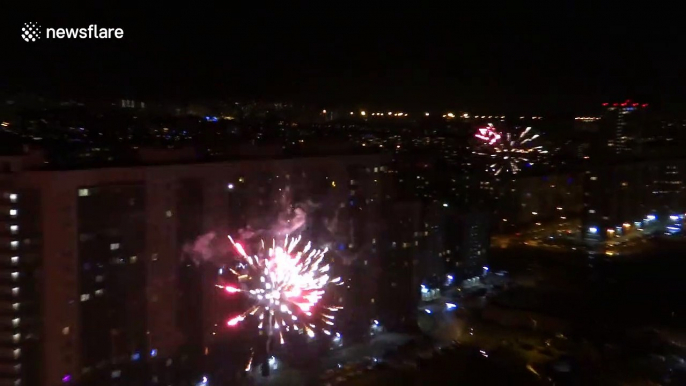 Russians celebrate New Year's Eve throughout the streets of St Petersburg