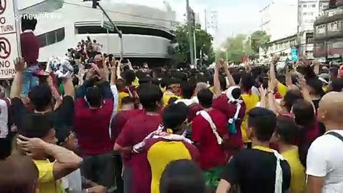 Chaotic scenes as Filipino Catholics scramble to touch Black Nazarene Jesus Christ statute