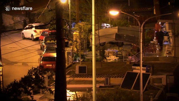 Greeks celebrate Orthodox Easter from the safety of their balconies amid COVID-19 lockdown