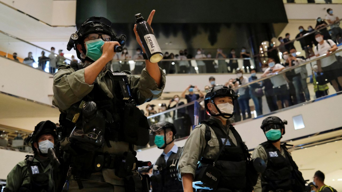 Hong Kong protests: police disperse demonstrators for defying coronavirus rules on crowd sizes