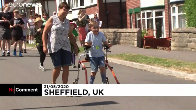 Nine-year-old British boy with cerebral palsy completes marathon charity walk