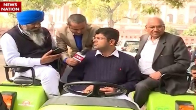 Winter Session: MP Dushyant Chautala rides tractor to Parliament