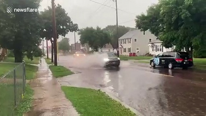 Flash flooding in Sioux Falls, South Dakota as heavy rain floods street amid intense storms