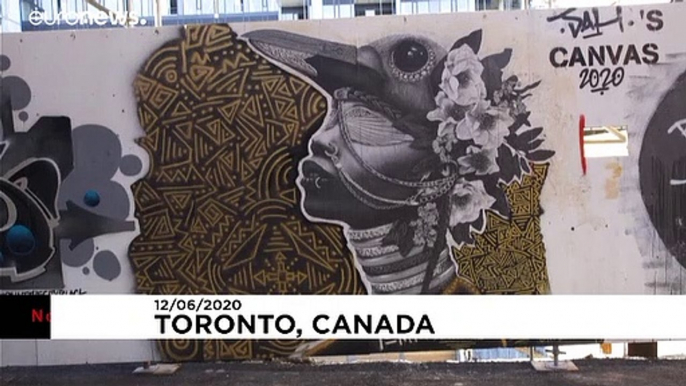 Toronto graffiti artists "paint the city black" against racism