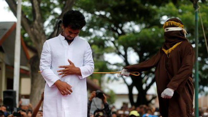 Two men publicly caned in Indonesia for having gay sex