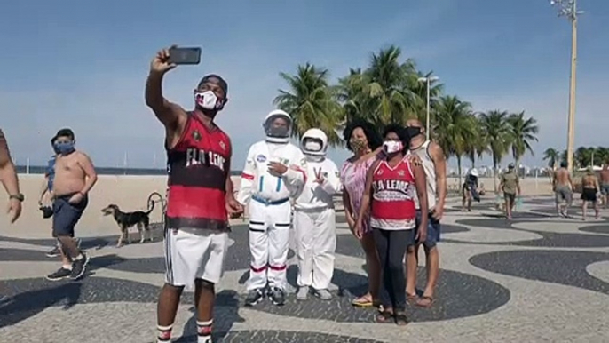 Brazilian couple wear space suits as virus protection