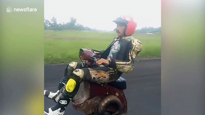 Scooter fanatics ride one-wheel vespa in Indonesia