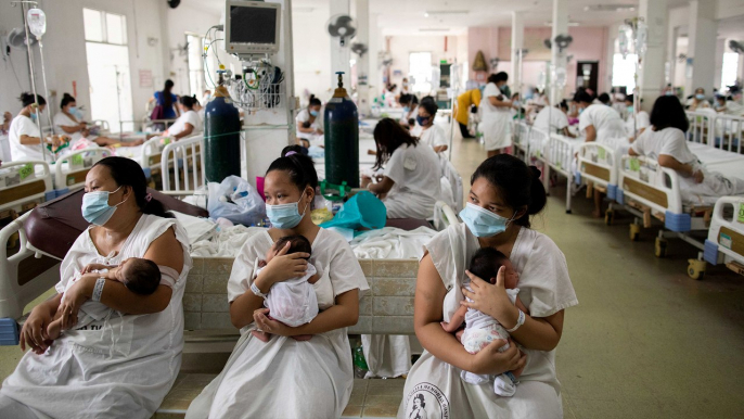 Mothers of newborns fear coronavirus infection risk in overcrowded Philippines maternity hospital