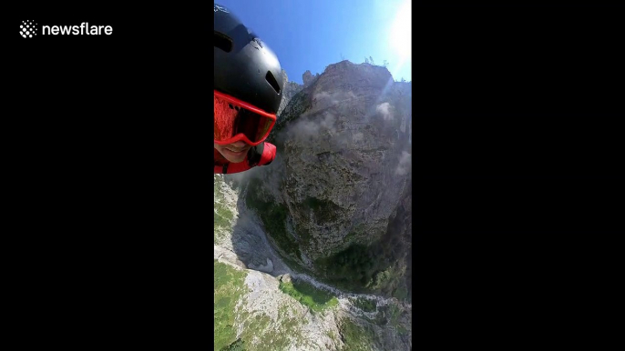 Incredible helmet camera footage of base jumper's rapid descent into Italian canyon