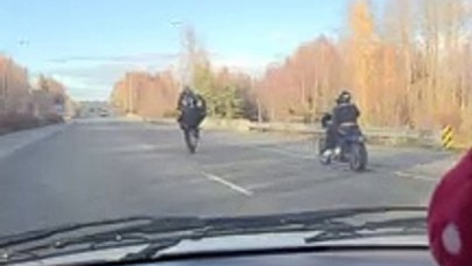 Motorcyclist Pops a Long Wheelie