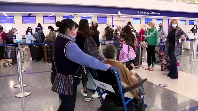 Millions travel for Thanksgiving despite warnings