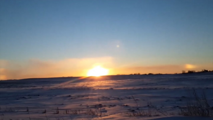 Sun dog spotted over frozen Minnesota landscape